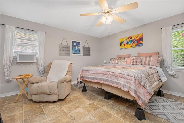 bedroom with cooling unit and ceiling fan