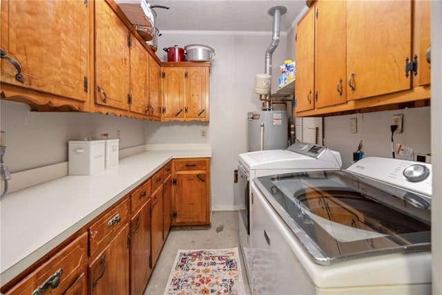 washroom featuring washing machine and clothes dryer, gas water heater, crown molding, cabinets, and a textured ceiling