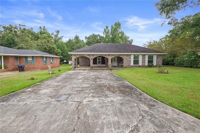 single story home featuring a carport and a front yard