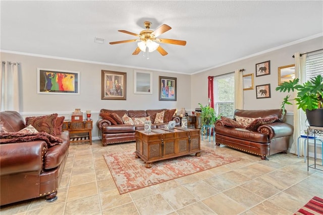 living room with light tile patterned floors, crown molding, and ceiling fan