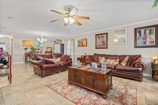 tiled living room with ceiling fan with notable chandelier and ornamental molding