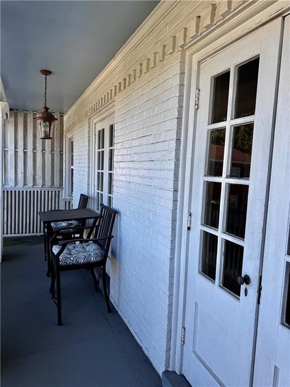 view of exterior entry with covered porch