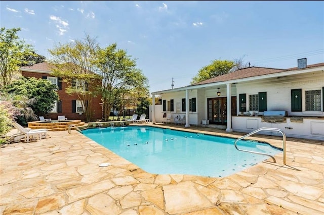 view of pool featuring area for grilling, a patio area, and grilling area