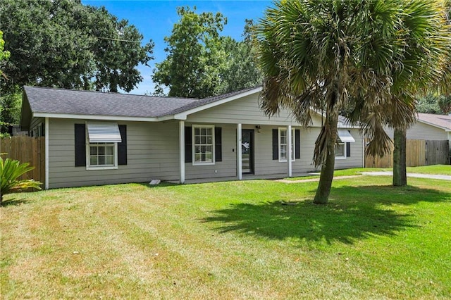 ranch-style home featuring a front yard