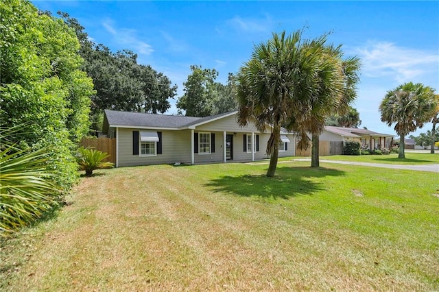 ranch-style home with a front yard