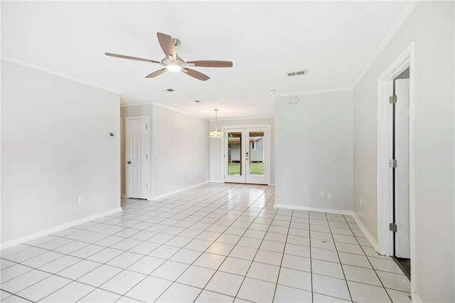 tiled empty room with ceiling fan, ornamental molding, and french doors