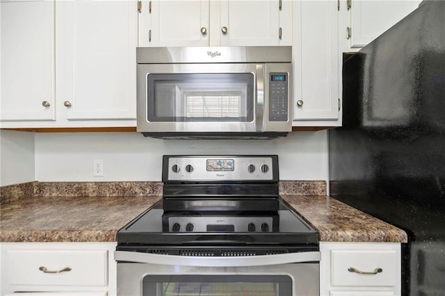 kitchen with white cabinetry and appliances with stainless steel finishes