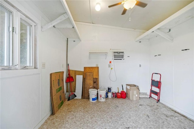 garage with ceiling fan and a wall unit AC