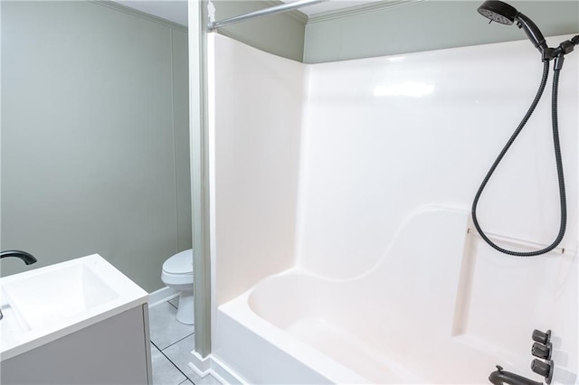 bathroom featuring toilet, vanity, and tile patterned floors