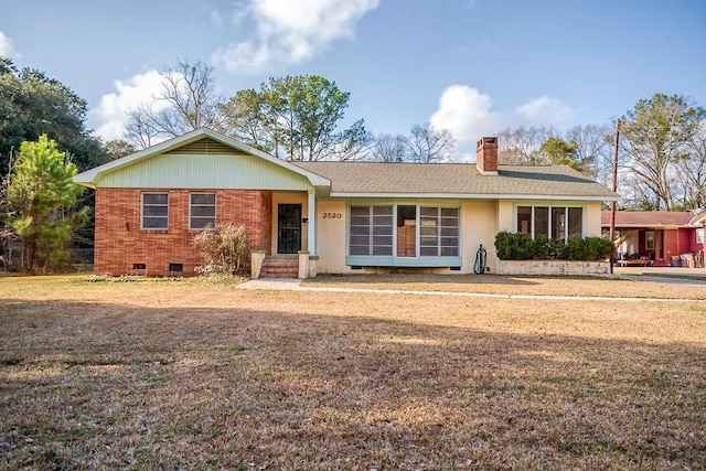 ranch-style home with a front lawn