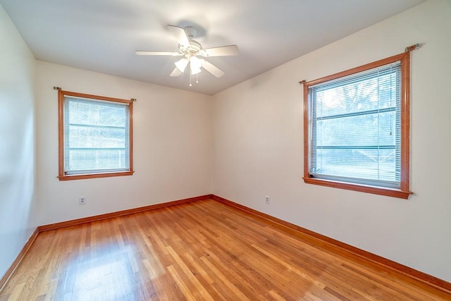 spare room featuring light hardwood / wood-style flooring and ceiling fan