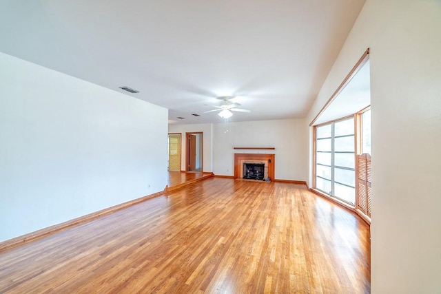 unfurnished living room with light hardwood / wood-style floors and ceiling fan