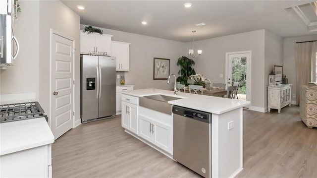 10676 Relic Rd N, Mobile, AL 36608 - kitchen with stainless steel appliances, a sink, light wood-type flooring, light countertops, and recessed lighting