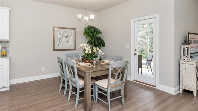 10676 Relic Rd N, Mobile, AL 36608 - dining room featuring light wood-style floors, baseboards, and a chandelier