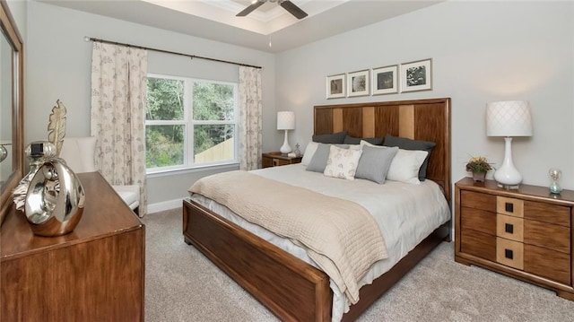 10676 Relic Rd N, Mobile, AL 36608 - bedroom with light carpet, baseboards, ceiling fan, and a raised ceiling