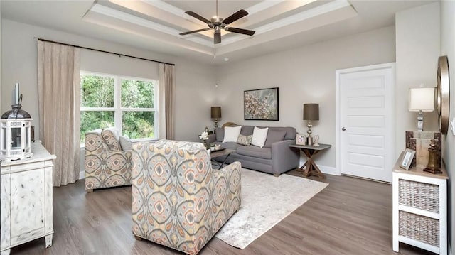 10676 Relic Rd N, Mobile, AL 36608 - living room featuring a raised ceiling, ceiling fan, wood finished floors, and baseboards