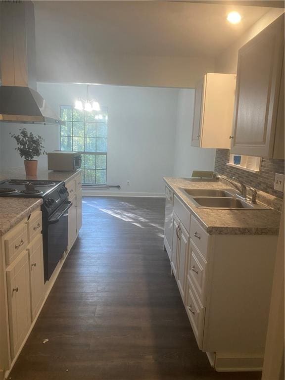 kitchen with dark hardwood / wood-style flooring, white appliances, sink, exhaust hood, and a notable chandelier