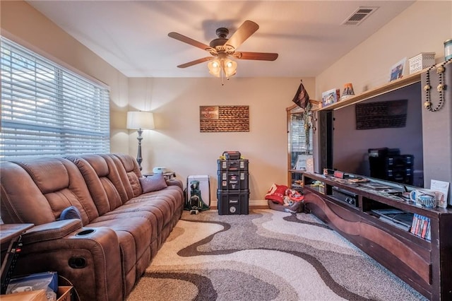 living room with carpet floors and ceiling fan