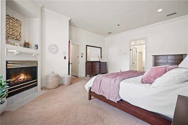 carpeted bedroom with recessed lighting, visible vents, a fireplace, and crown molding