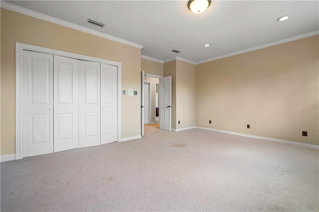 unfurnished bedroom featuring visible vents, baseboards, a closet, and ornamental molding