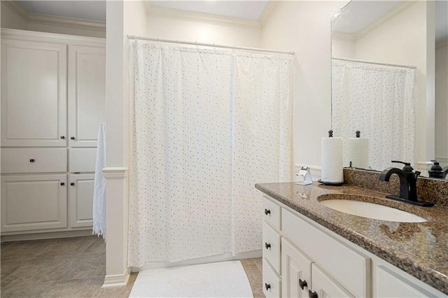 full bathroom featuring vanity, crown molding, and tile patterned flooring