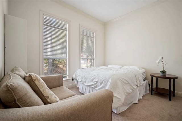 bedroom featuring carpet flooring, baseboards, and ornamental molding