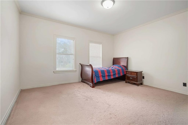 carpeted bedroom with baseboards and ornamental molding