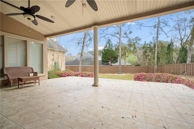 view of patio featuring a ceiling fan and fence