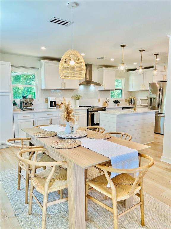 2026 Norman Ln, Gulf Shores, AL 36542 - dining room featuring recessed lighting, visible vents, and light wood-style flooring