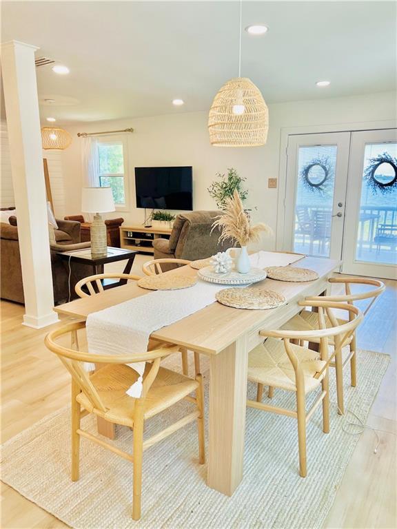 2026 Norman Ln, Gulf Shores, AL 36542 - dining space with light wood-style flooring, french doors, and recessed lighting