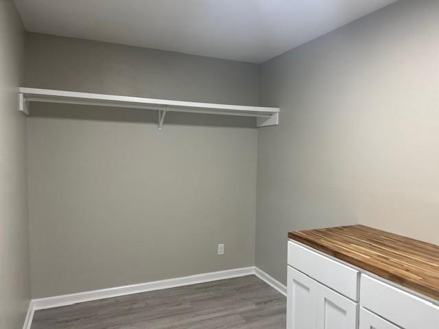 laundry area featuring hardwood / wood-style flooring