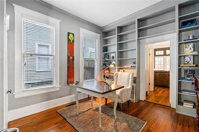 office featuring dark hardwood / wood-style floors and crown molding