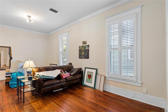 living room with hardwood / wood-style flooring and crown molding