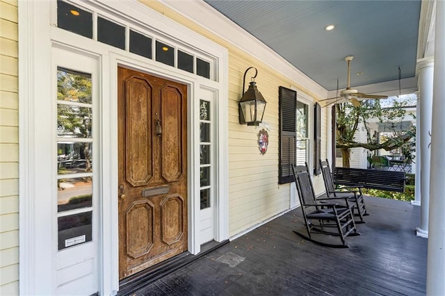 entrance to property with ceiling fan