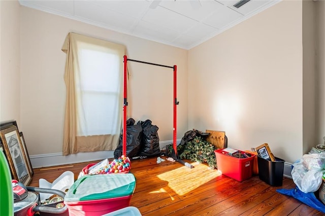 misc room with hardwood / wood-style flooring and crown molding