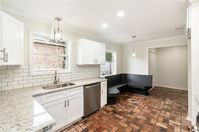 kitchen with white cabinets, decorative light fixtures, stainless steel dishwasher, and sink