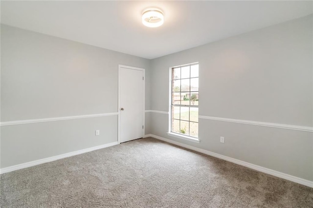 unfurnished room featuring carpet floors