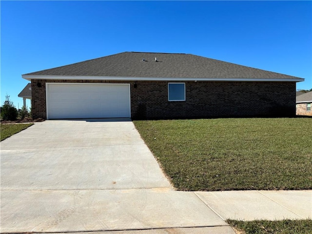 view of side of home featuring a garage and a lawn