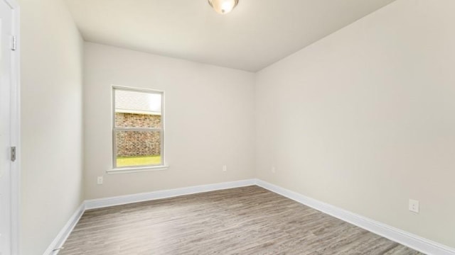 empty room featuring wood-type flooring