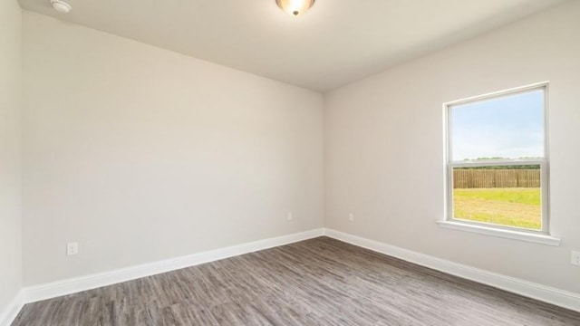 empty room featuring dark wood-type flooring