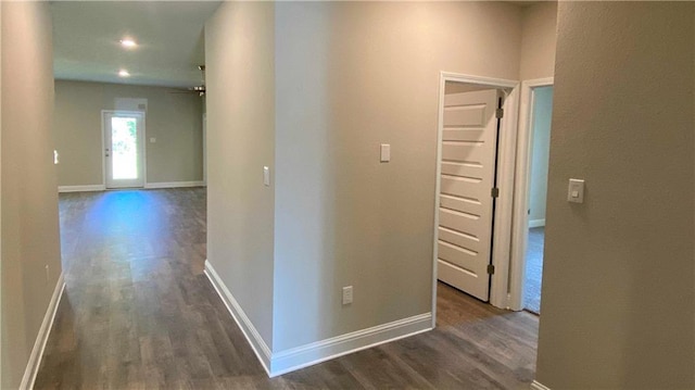 hallway featuring dark hardwood / wood-style flooring