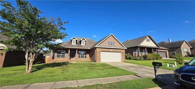 2509 Hedgerow Dr, Mobile, AL 36695 - view of front of home featuring brick siding, an attached garage, a front yard, and concrete driveway