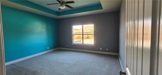 2509 Hedgerow Dr, Mobile, AL 36695 - spare room featuring a ceiling fan, baseboards, carpet floors, and a raised ceiling