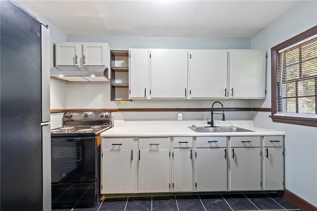 kitchen featuring white cabinetry, black electric range, sink, and stainless steel refrigerator