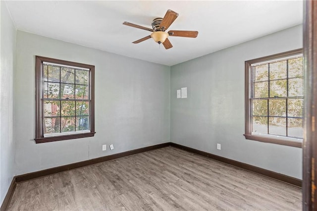 unfurnished room featuring light hardwood / wood-style flooring and ceiling fan