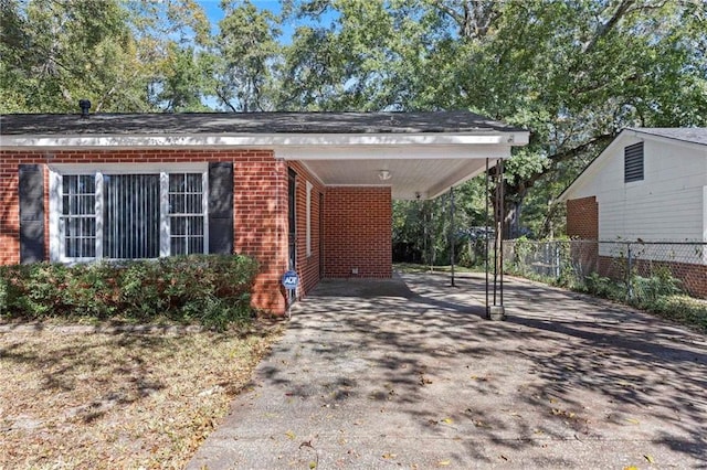 exterior space featuring a carport