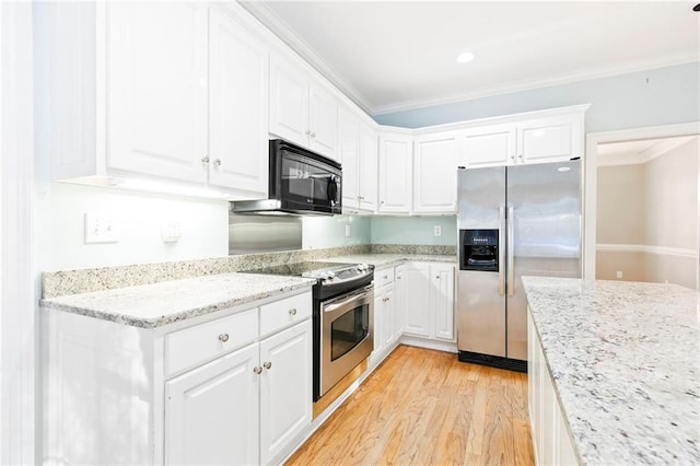 kitchen featuring white cabinets, light stone counters, ornamental molding, and appliances with stainless steel finishes