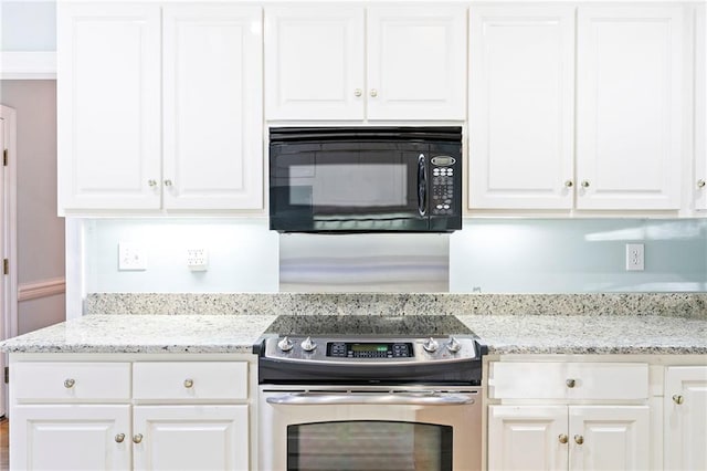 kitchen featuring white cabinets, stainless steel electric range, and light stone countertops