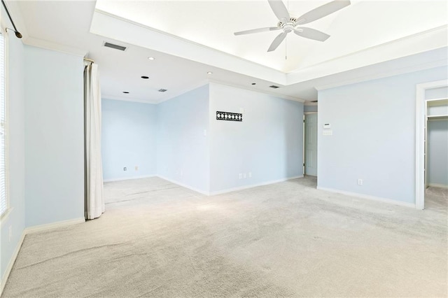 carpeted empty room with ceiling fan and ornamental molding