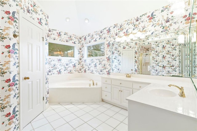 bathroom featuring tile patterned flooring, vanity, and plus walk in shower